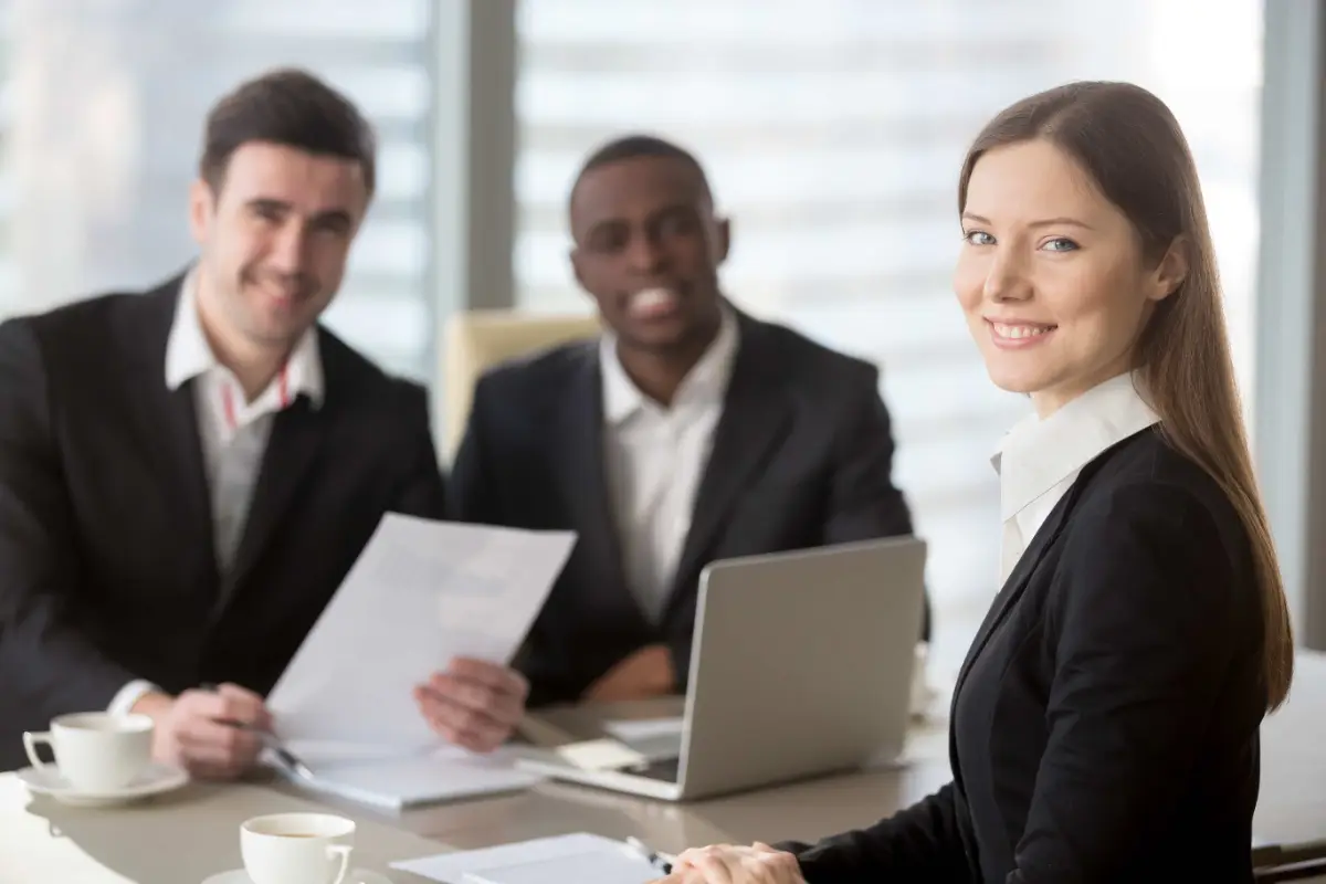 Business team discussing an SEO growth plan and keyword report in a meeting
