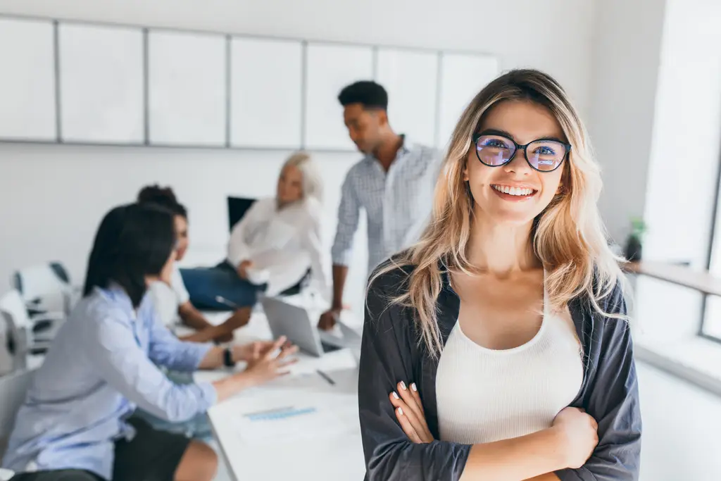 Business owner smiling after her website started ranking higher on Google with SEO services